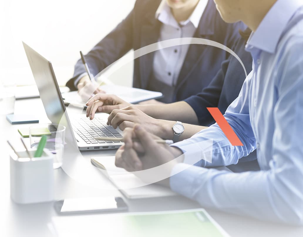 Two people working at a computer